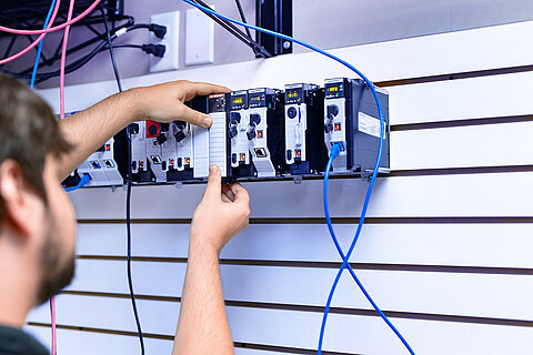 Employee checking a controller modul.