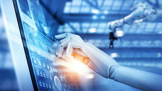 Robot hand pressing a display with its finger.