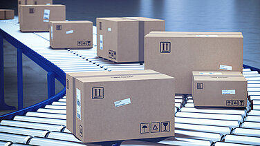 View of several small parcels on a conveyor belt.