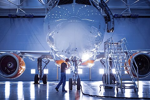 Airplane in a production hall.